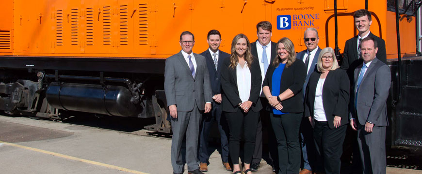 Boone Bank & Trust Co. Employees Next to Restored Boone & Scenic Valley Railroad Locomotive